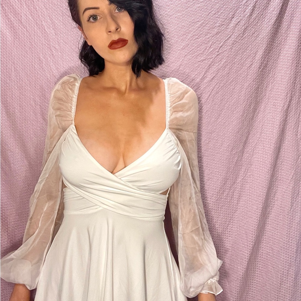 White criss cross front mini dress with sheer balloon sleeves